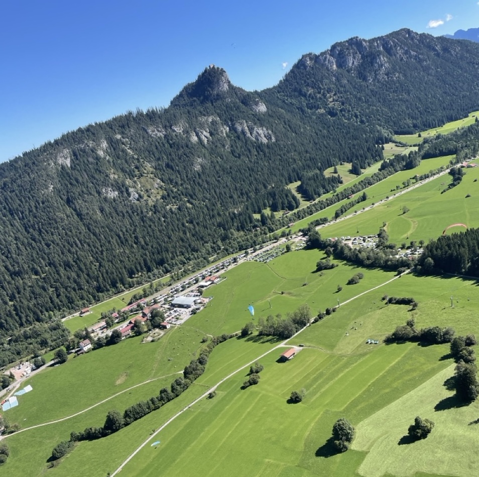 Approach to Breitenberg landing site - Paraglider approaching the landing meadow